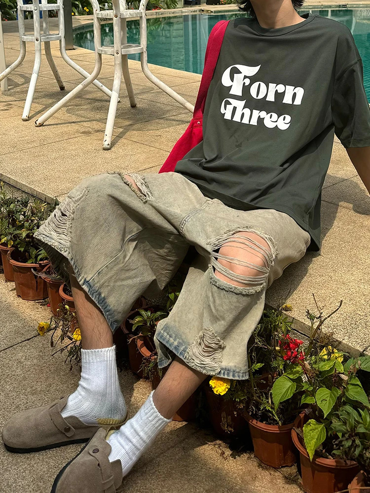 Hip Hop 2024 Hollow Hole Loose Jeans Shorts Streetwear Summer Fashion Ripped Denim Pant Men Clothing Solid Color Male Trousers 240530