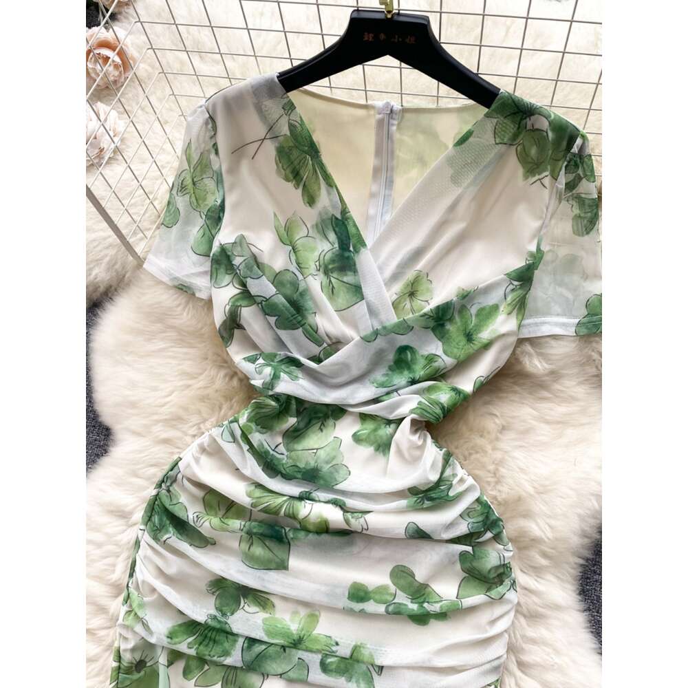 Summer new French niche pleated V-neck short sleeved printed mesh wrap hip skirt for womens slim fit and slimming dress trend