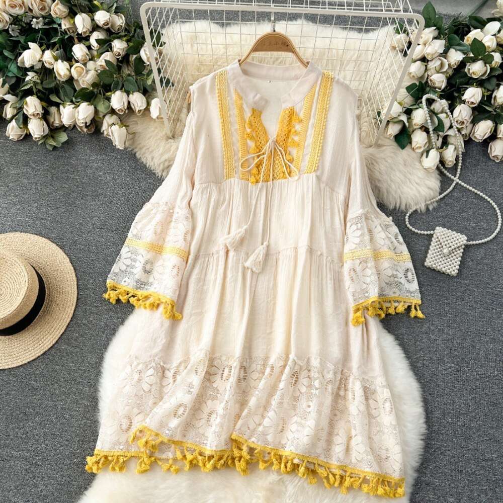 Korean style early spring vacation dress for women with a design sense of hollowed out flared sleeves tassels loose and slimming lace skirt