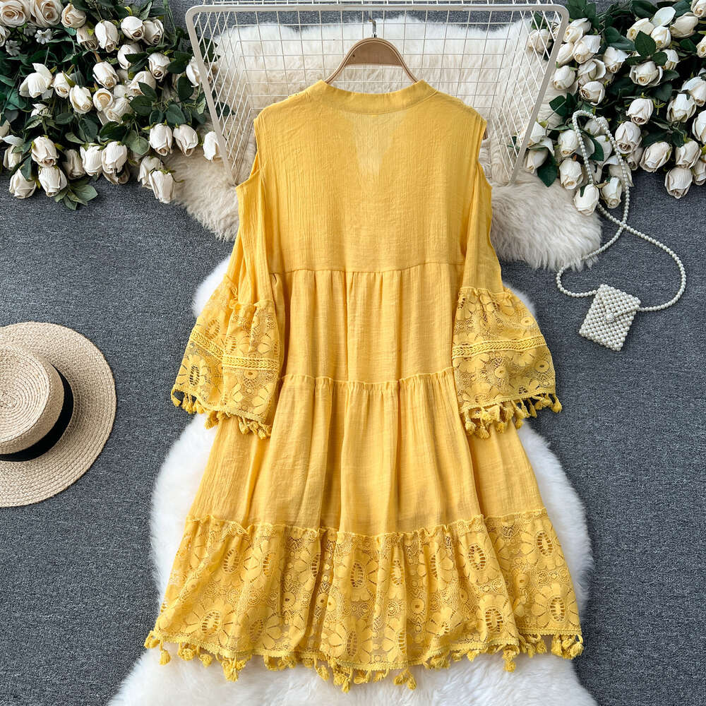 Korean style early spring vacation dress for women with a design sense of hollowed out flared sleeves tassels loose and slimming lace skirt