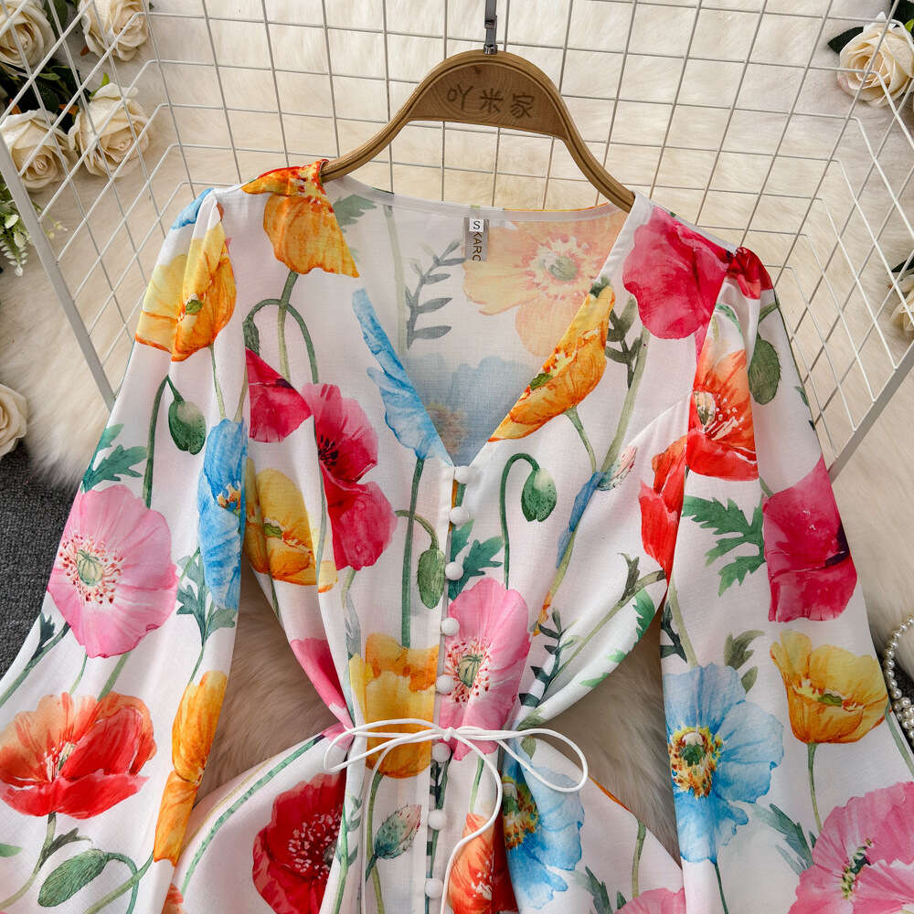 Spring and autumn design sense socialite temperament lantern long sleeved V-neck waistband slimming effect single breasted A-line printed dress for wo