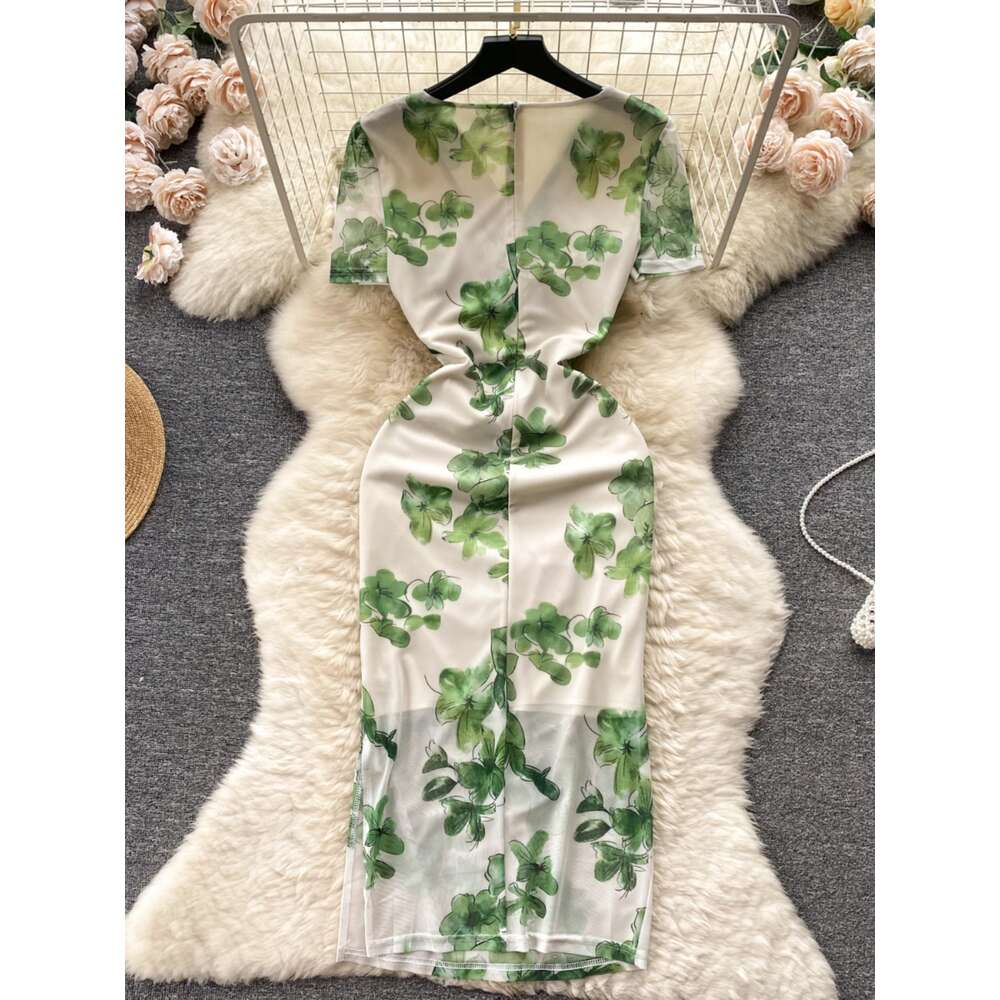 Summer new French niche pleated V-neck short sleeved printed mesh wrap hip skirt for womens slim fit and slimming dress trend