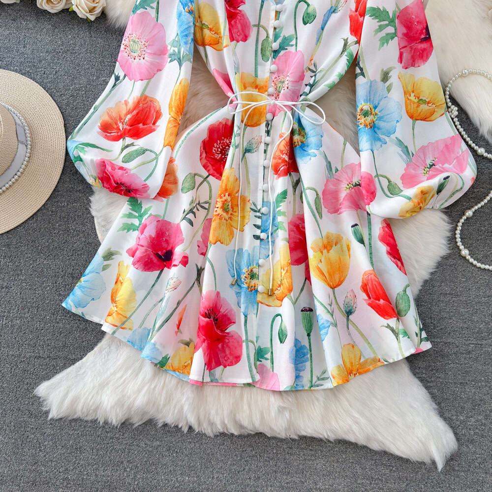 Spring and autumn design sense socialite temperament lantern long sleeved V-neck waistband slimming effect single breasted A-line printed dress for wo