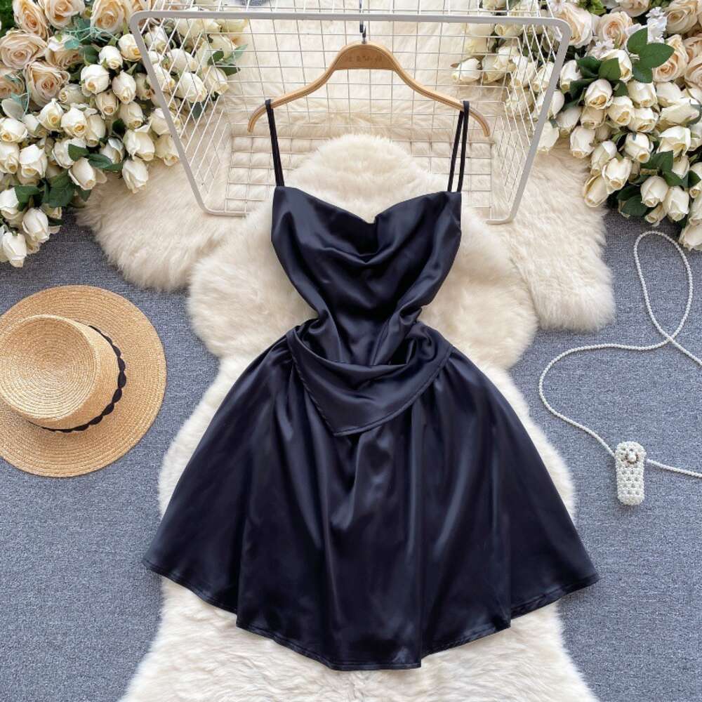 Light luxury and high-end satin dress for women with a fake design. Two slim fitting short A-line skirt and sexy suspender dress