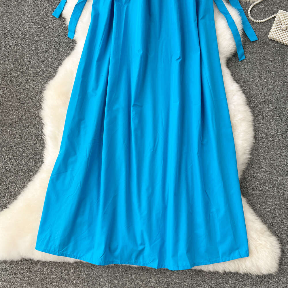 French dress for women with a high-end feel revealing a white blue loose fit and slimming effect. Mid length lazy style vacation dress tank top skirt