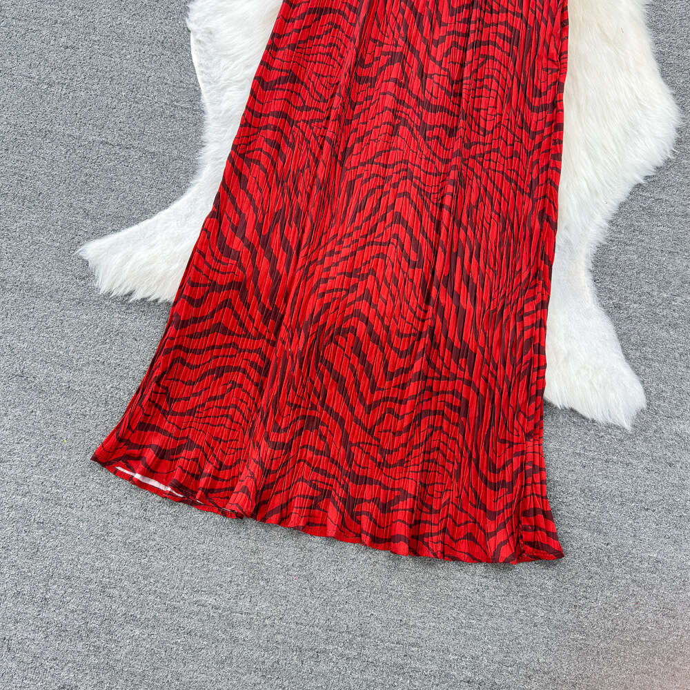 Fashionable seaside vacation neck hanging backless loose fitting mid length A-line printed dress for travel wear camisole long dress