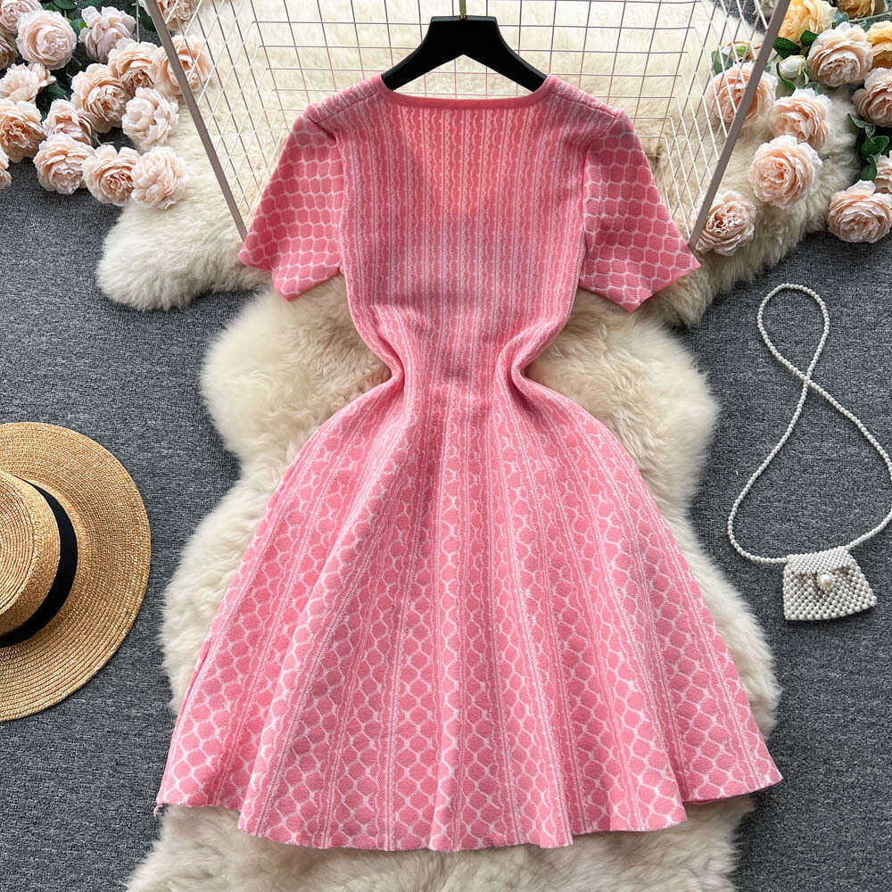 Knitted dress 2023 new womens summer clothing Korean version temperament V-neck slim fit short A-line large hem short skirt childrens trend