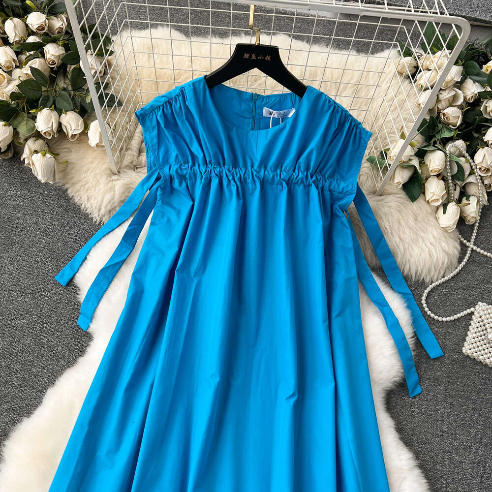 French dress for women with a high-end feel revealing a white blue loose fit and slimming effect. Mid length lazy style vacation dress tank top skirt