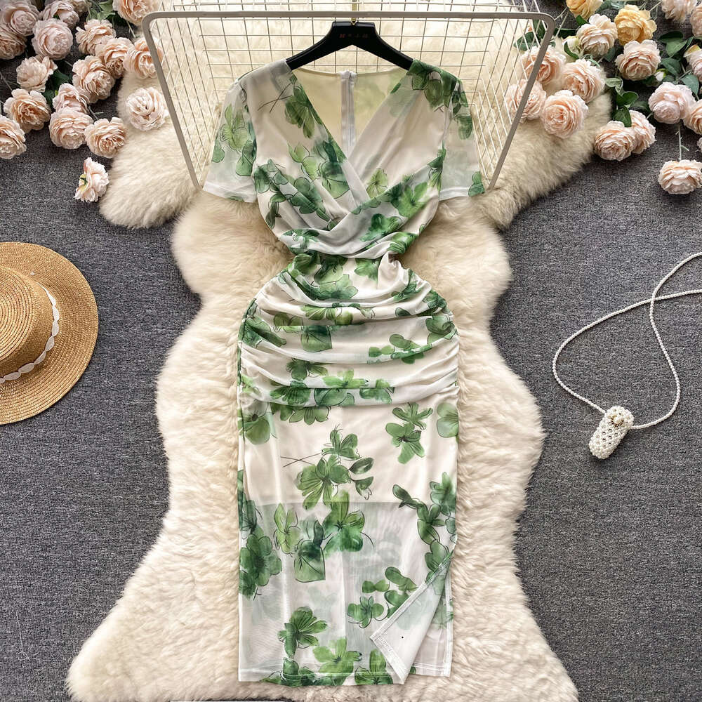 Summer new French niche pleated V-neck short sleeved printed mesh wrap hip skirt for womens slim fit and slimming dress trend