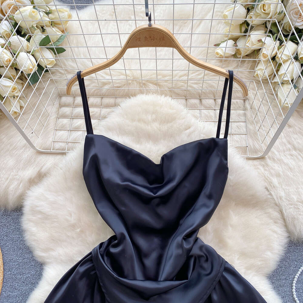 Light luxury and high-end satin dress for women with a fake design. Two slim fitting short A-line skirt and sexy suspender dress