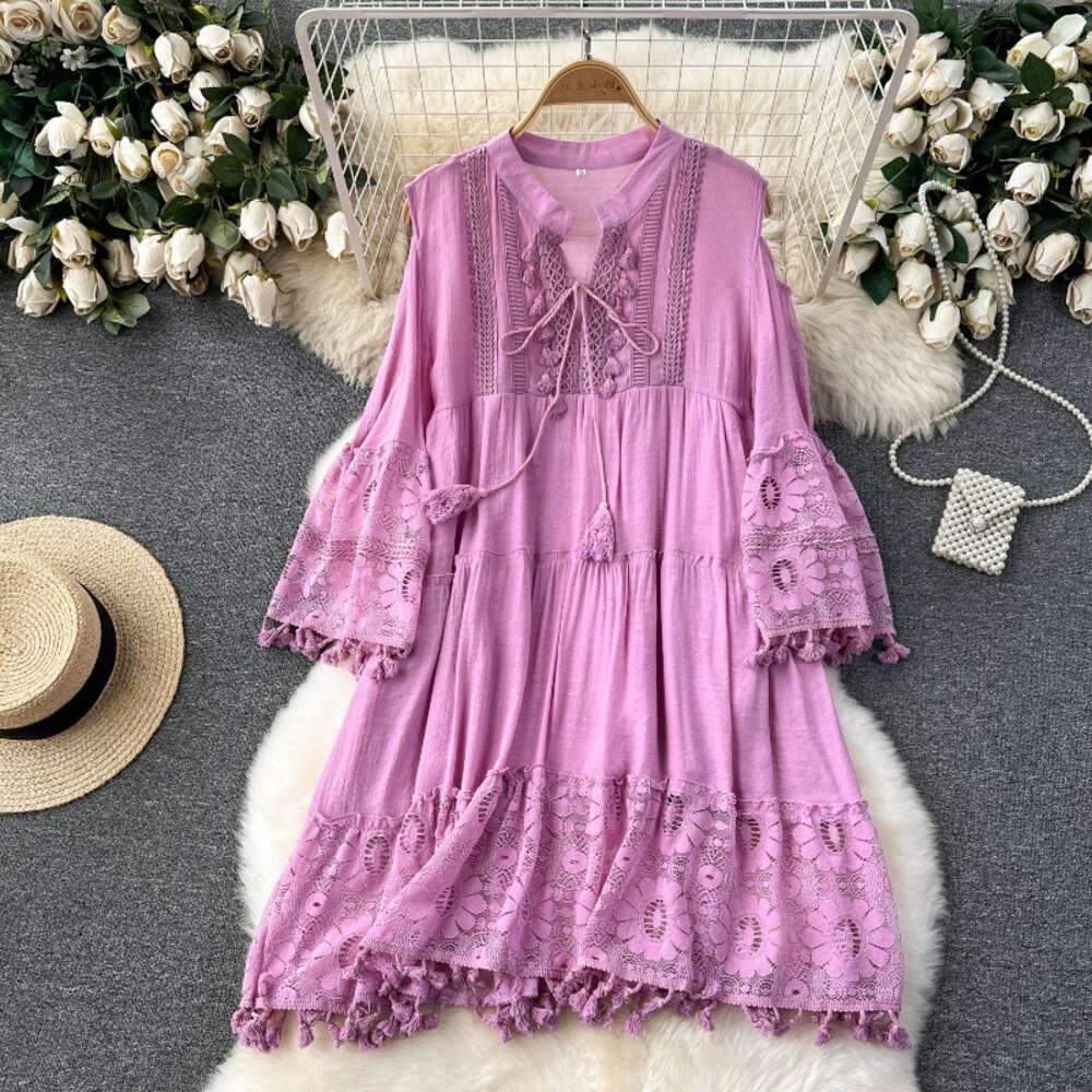 Korean style early spring vacation dress for women with a design sense of hollowed out flared sleeves tassels loose and slimming lace skirt