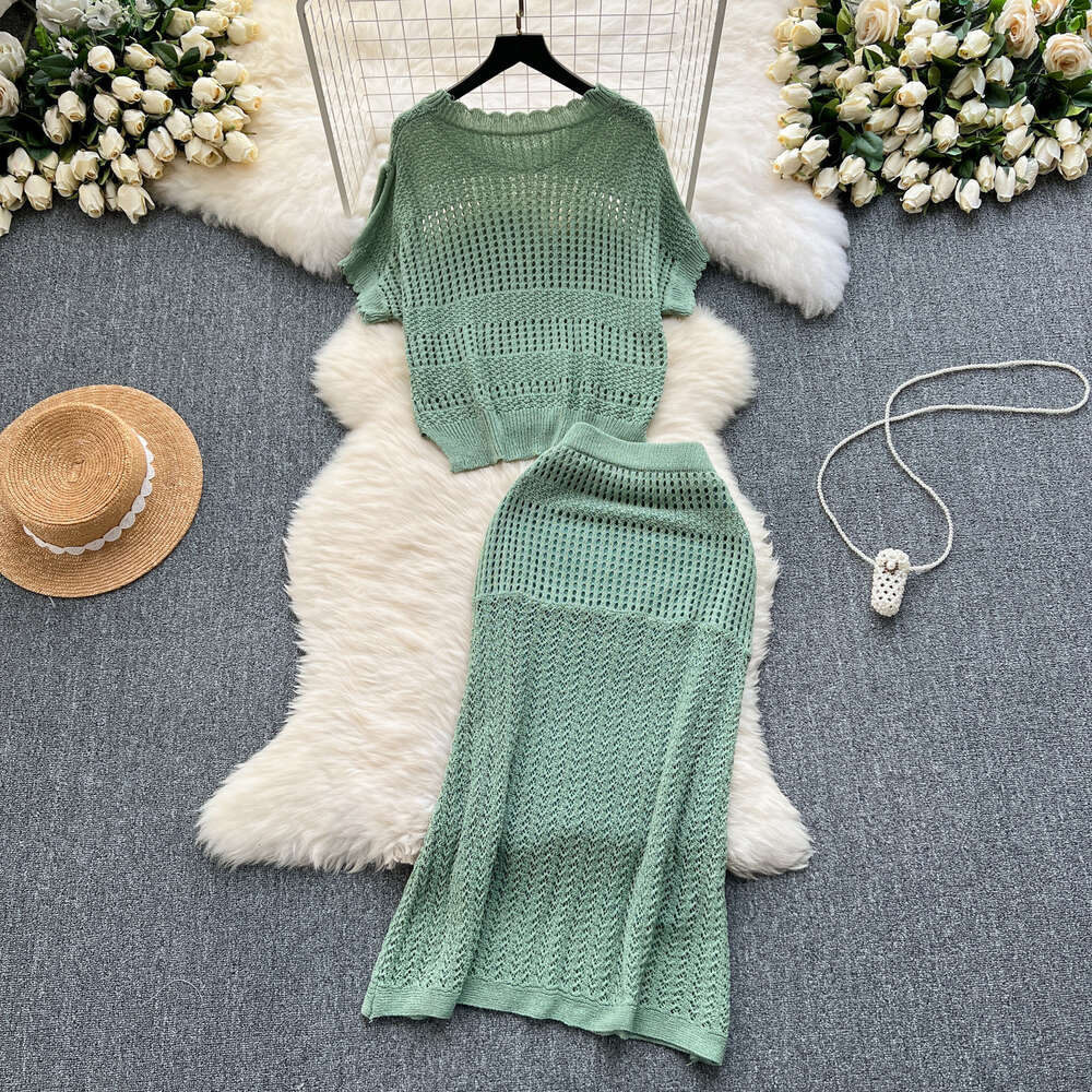 Wearing a full set of design inspired hollowed out knit tops for summer loose and versatile half skirts for casual two-piece sets trendy