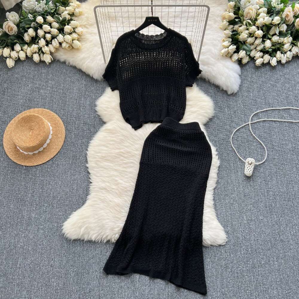 Wearing a full set of design inspired hollowed out knit tops for summer loose and versatile half skirts for casual two-piece sets trendy