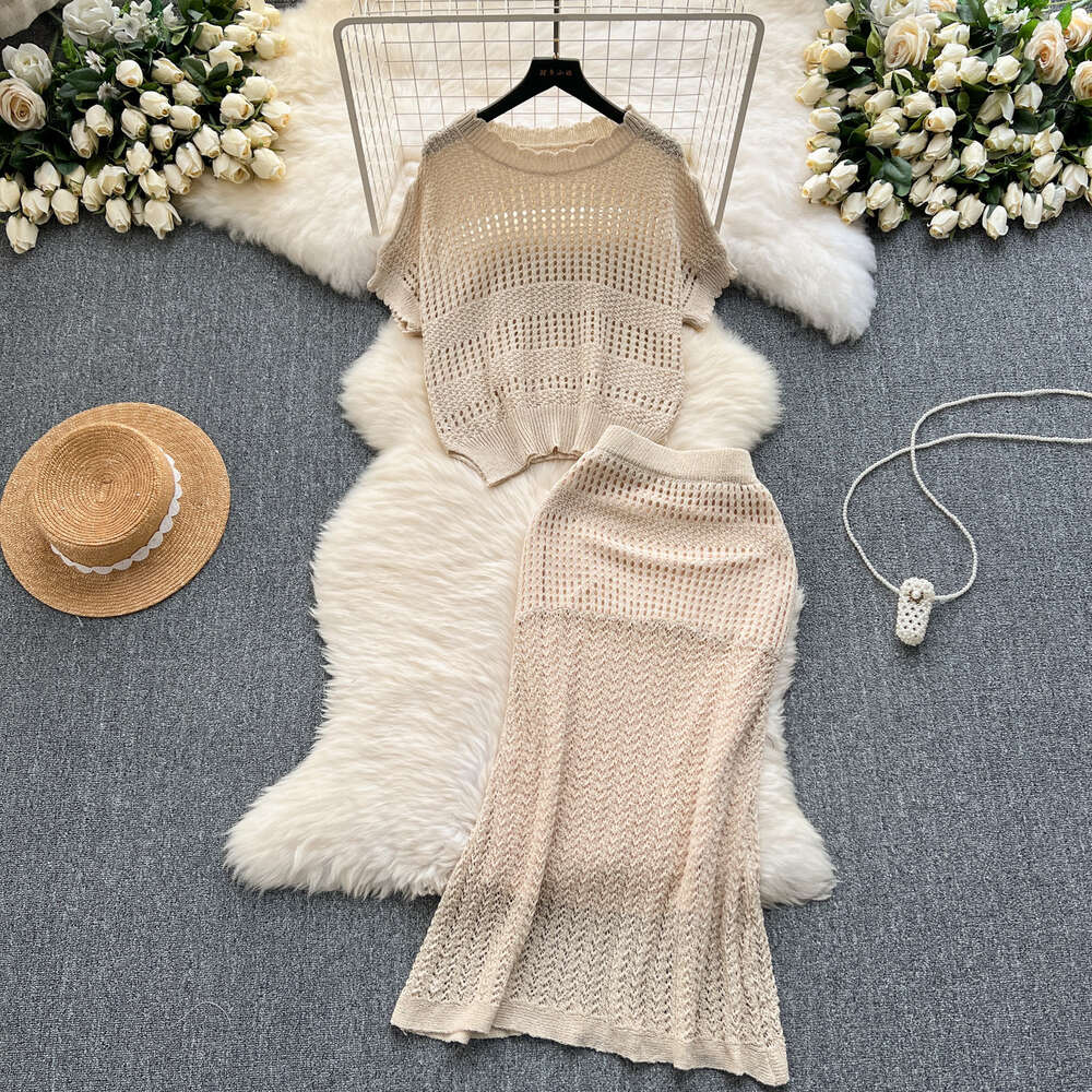 Wearing a full set of design inspired hollowed out knit tops for summer loose and versatile half skirts for casual two-piece sets trendy