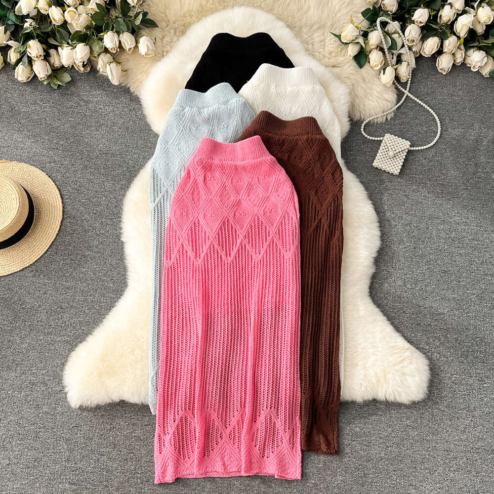 Korean version of womens clothing design with diamond grid hollow knit skirt womens high waisted and slim mid length solid color buttocks wrapped skir