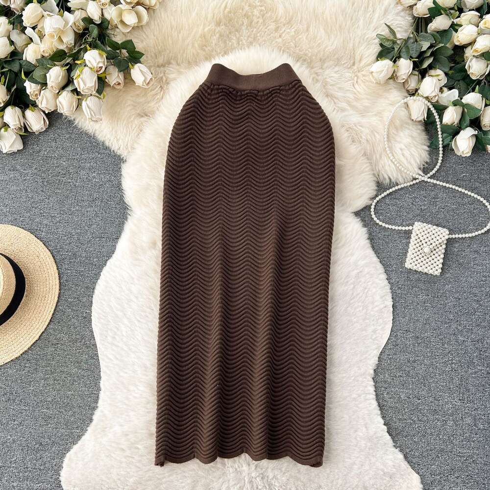 Candy colored sweater skirt with a luxurious texture 2023 new high waisted versatile mid length wave patterned skirt for women