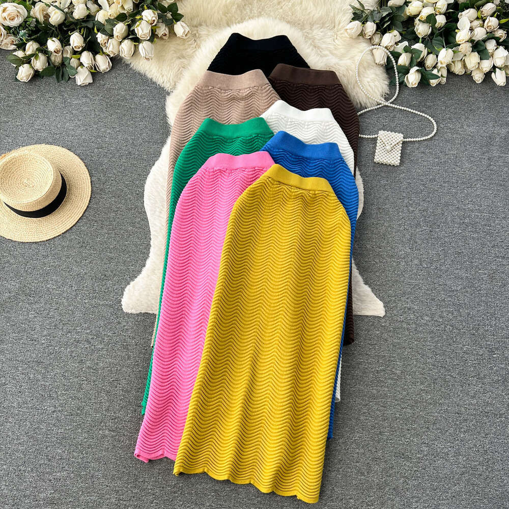 Candy colored sweater skirt with a luxurious texture 2023 new high waisted versatile mid length wave patterned skirt for women