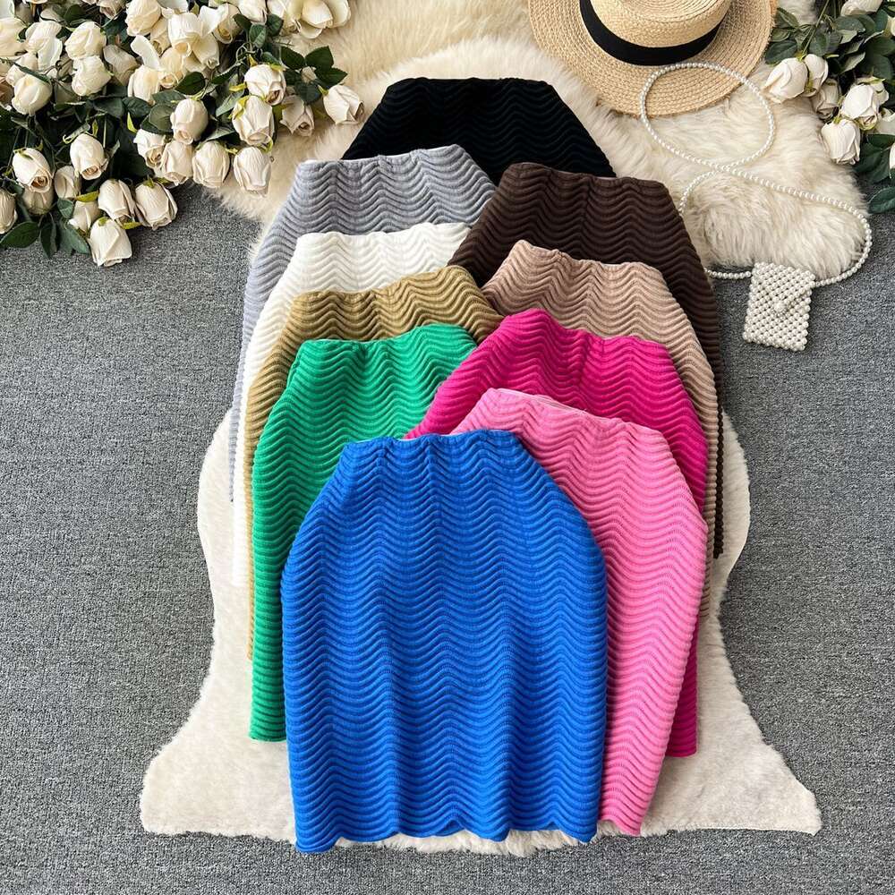 Candy colored sweater skirt with a luxurious texture 2023 new high waisted versatile mid length wave patterned skirt for women