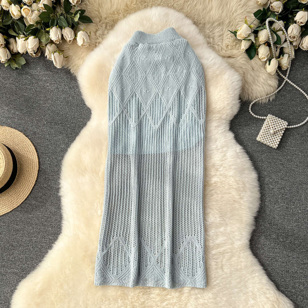 Korean version of womens clothing design with diamond grid hollow knit skirt womens high waisted and slim mid length solid color buttocks wrapped skir