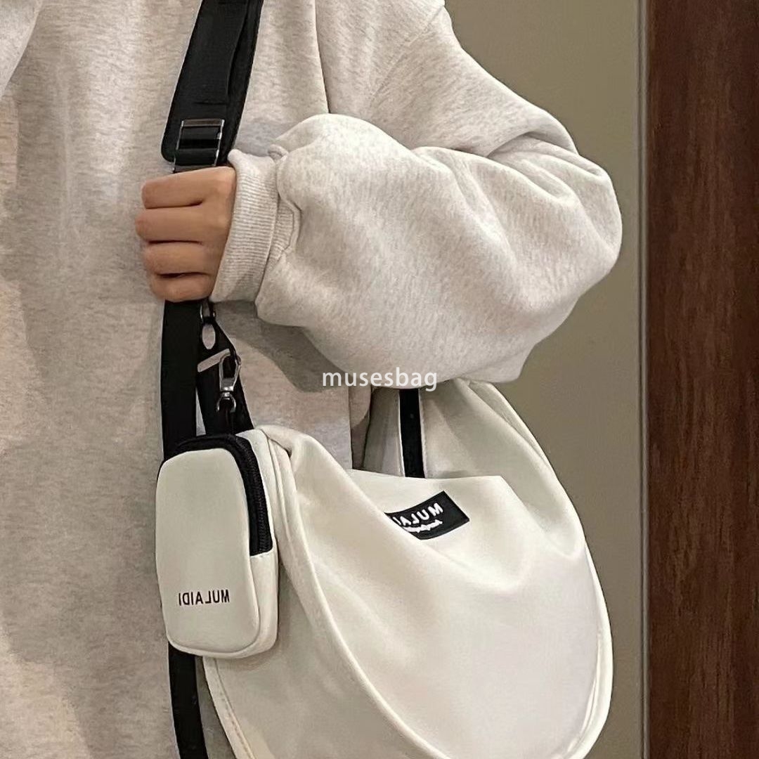 Japanese casual dumplings, sports style crossbody bag, women's large capacity canvas bag, student class one shoulder commuting bag, trendy