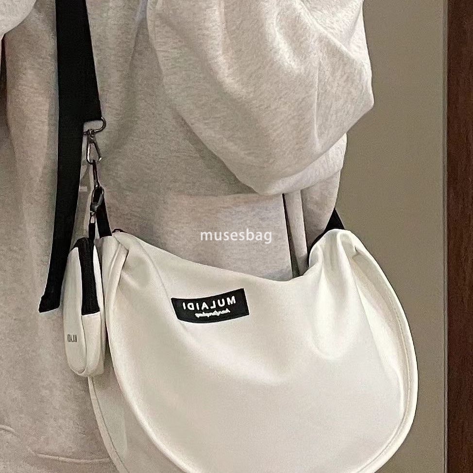 Japanese casual dumplings, sports style crossbody bag, women's large capacity canvas bag, student class one shoulder commuting bag, trendy