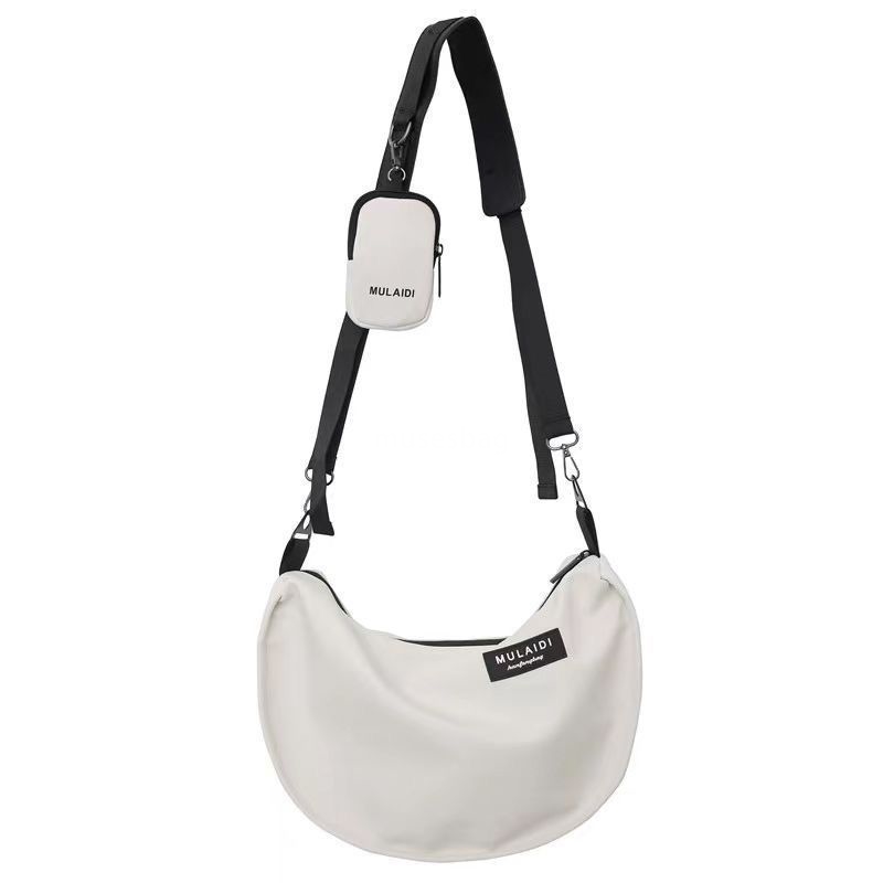Japanese casual dumplings, sports style crossbody bag, women's large capacity canvas bag, student class one shoulder commuting bag, trendy