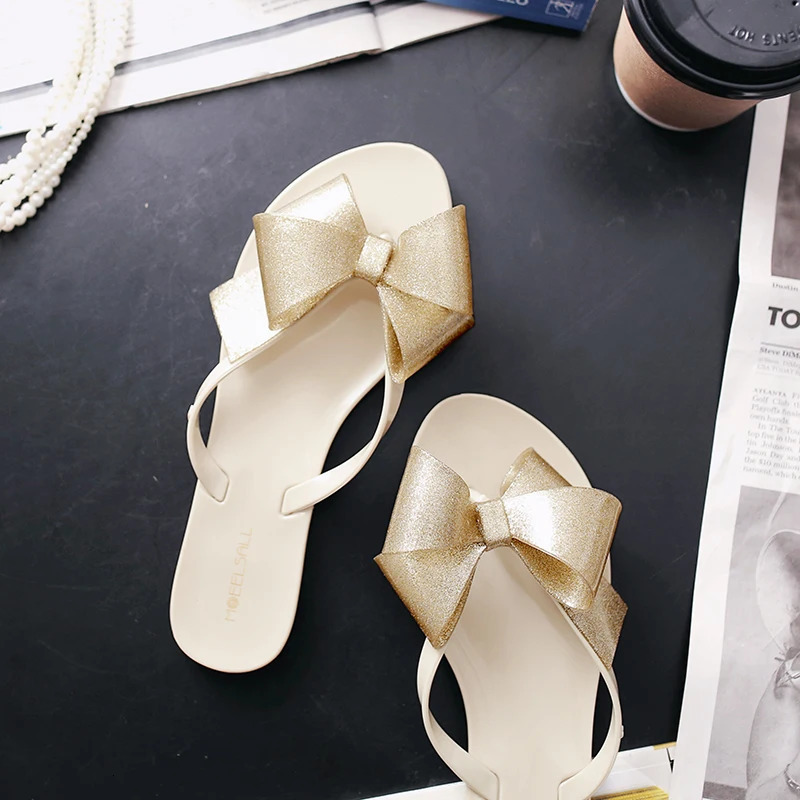 Shiny bow toe clip jelly sandals womens skates womens sweet fairy shoes rain proof flat sandals 240612