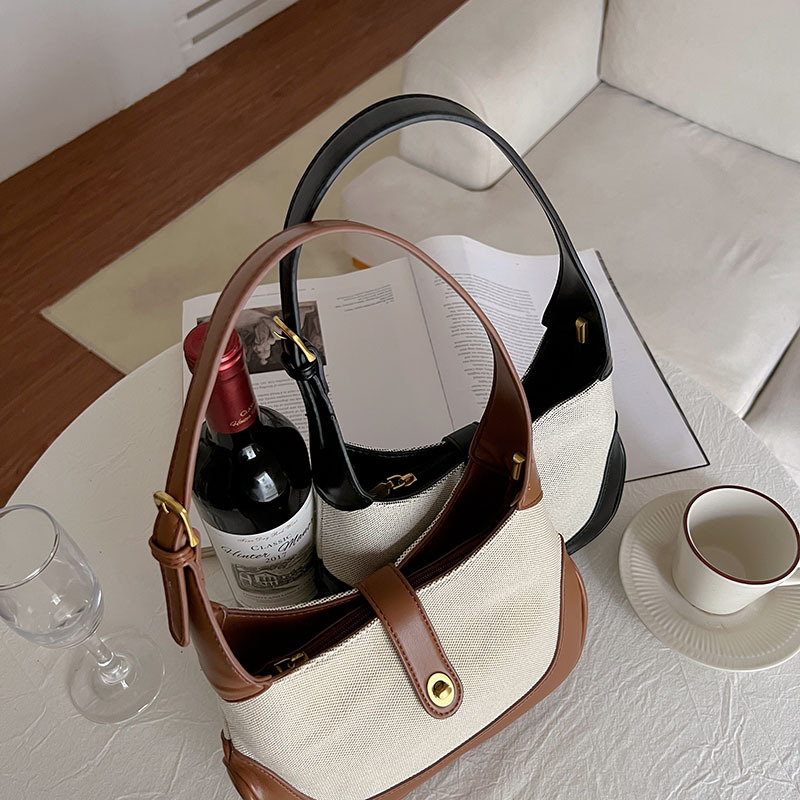 Advanced two-color patchwork retro canvas bag for commuting portable single shoulder underarm bag contrasting color handbag high-quality law stick bag