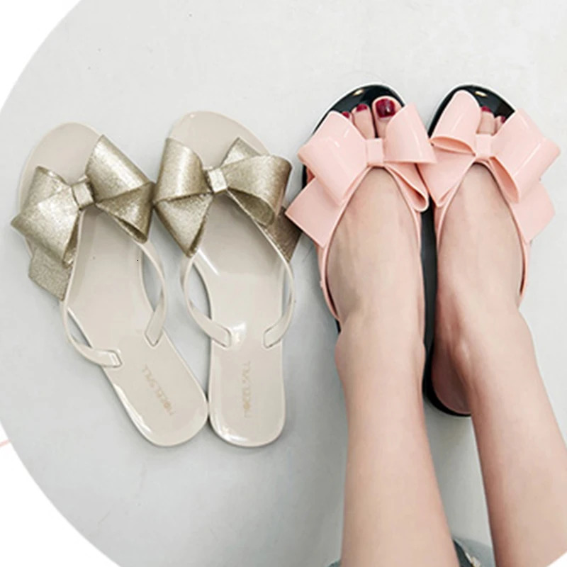 Shiny bow toe clip jelly sandals womens skates womens sweet fairy shoes rain proof flat sandals 240612