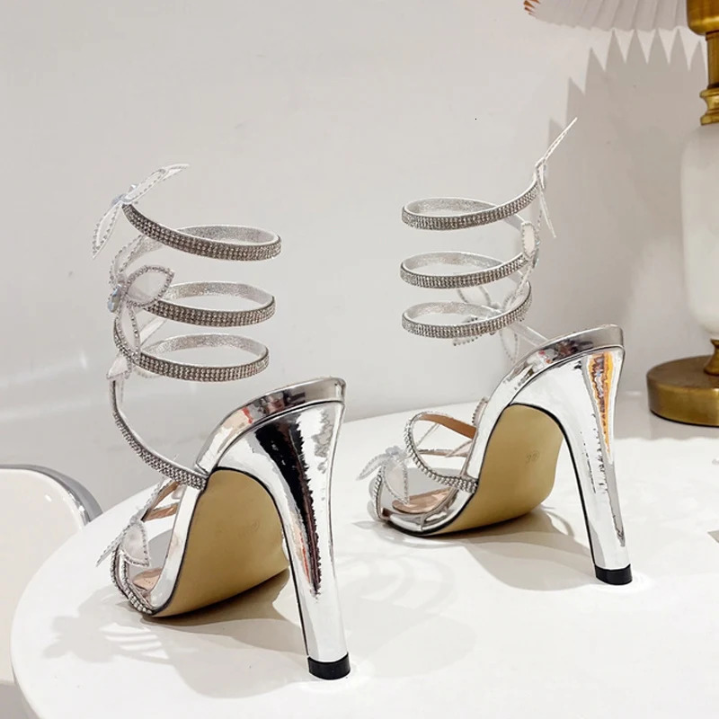 Liyke 2024 Crystal Butterfly Open Toen Thin High Heels Fashion Rhinestone Snake Coiled Ankle Strap Sandals Women Summer Shoe 240615