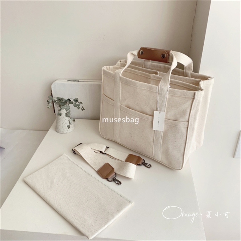 Korean Instagram Mommy Bag Fashionable Multi functional Mother and Baby Outgoing One Shoulder Crossbody Handheld Canvas Mom Bag Student Commuting Esse