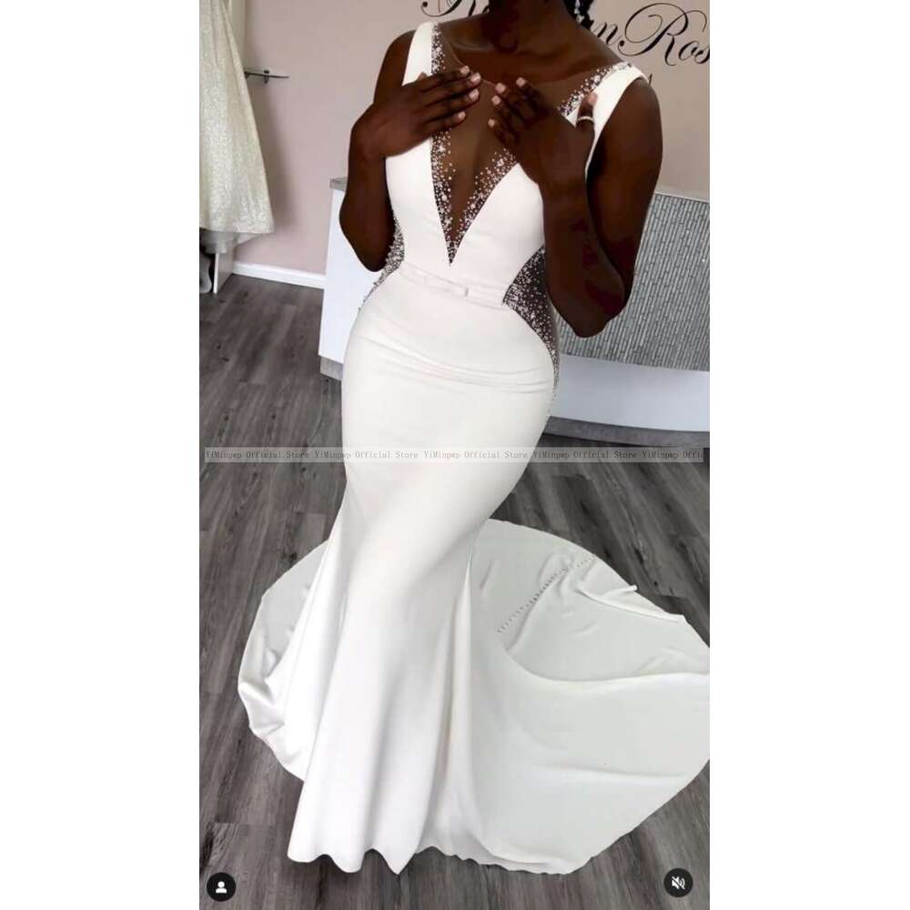 Stunning Mermaid Wedding Dresses for Bride Sheer Neck Sleeveless Sweep Train See Through Beads African Beach Garden Bridal Gowns