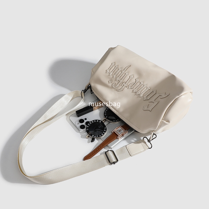 Small group Gothic letter embroidered casual solid color crossbody cylinder bag for women's new single shoulder crossbody bag trend