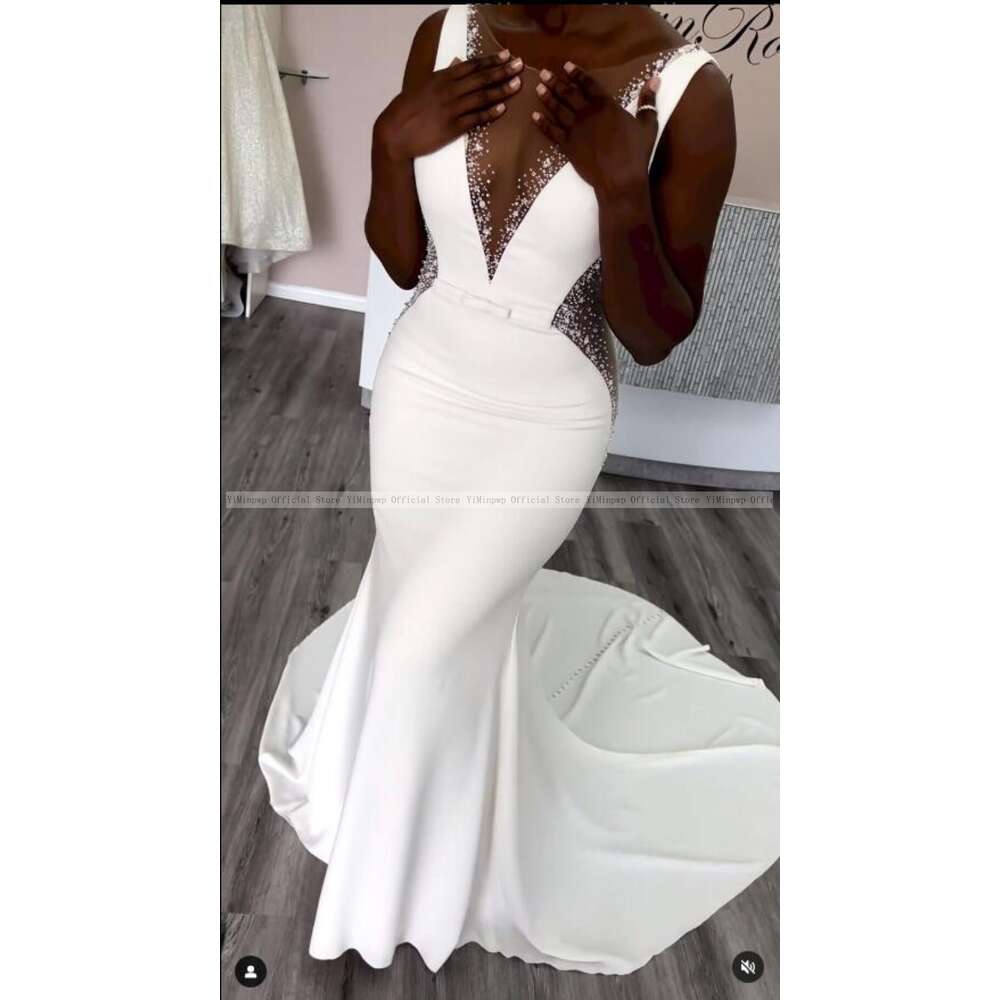 Stunning Mermaid Wedding Dresses for Bride Sheer Neck Sleeveless Sweep Train See Through Beads African Beach Garden Bridal Gowns