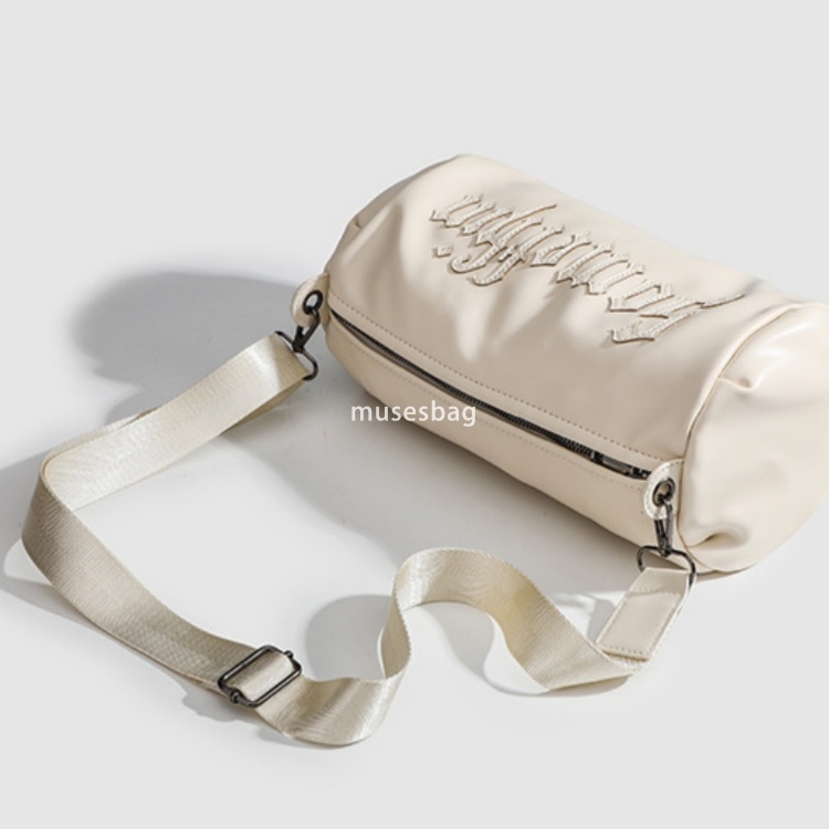 Small group Gothic letter embroidered casual solid color crossbody cylinder bag for women's new single shoulder crossbody bag trend