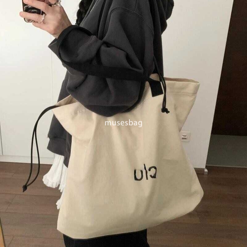 Korean women's high-quality and fashionable large looking tote bag with a lazy style and simple drawstring canvas shoulder bag universal bag for 