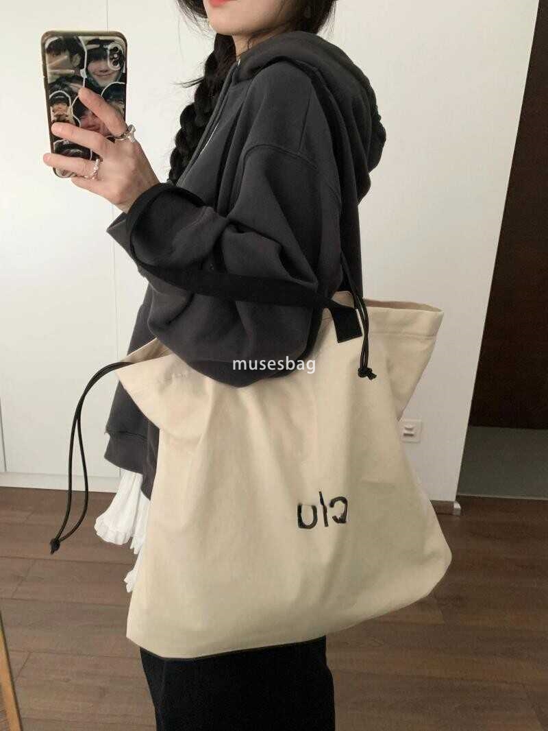 Korean women's high-quality and fashionable large looking tote bag with a lazy style and simple drawstring canvas shoulder bag universal bag for 