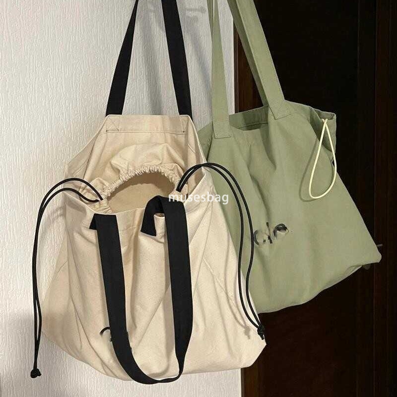 Korean women's high-quality and fashionable large looking tote bag with a lazy style and simple drawstring canvas shoulder bag universal bag for 