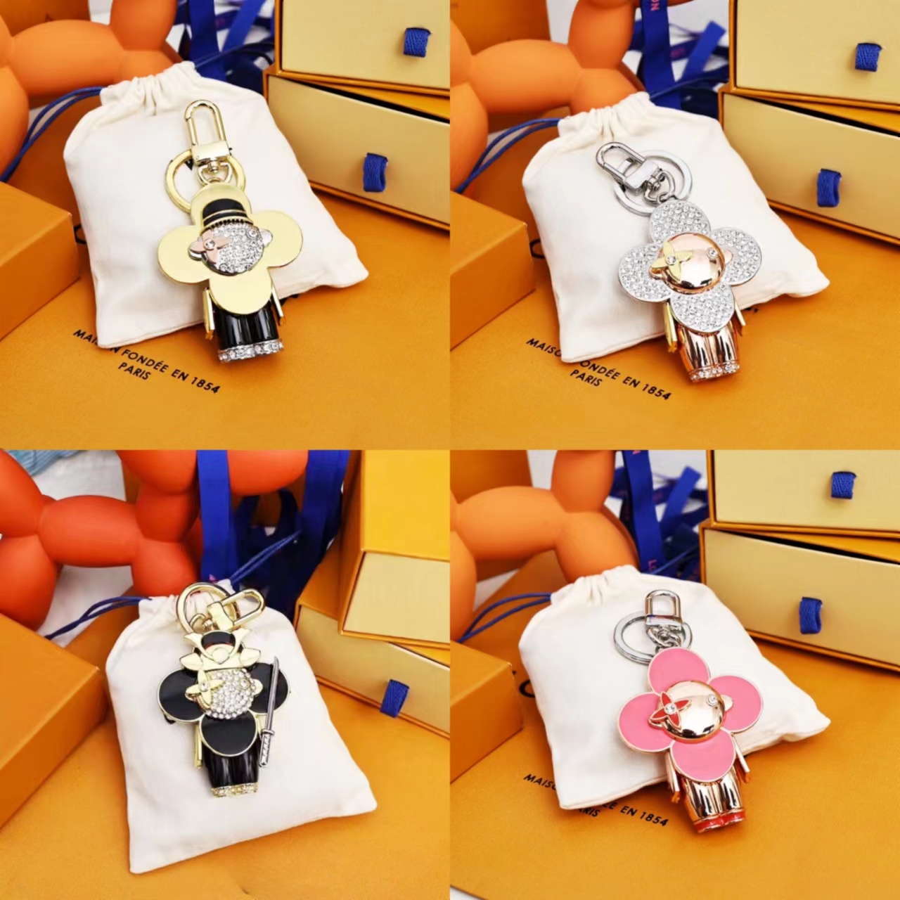 Classic Exquisite Designer Fashion High Quality Unisex Leather Bag Lanyard Gold Plated Car Keychain Cartoon With Letters Top005 610E toon