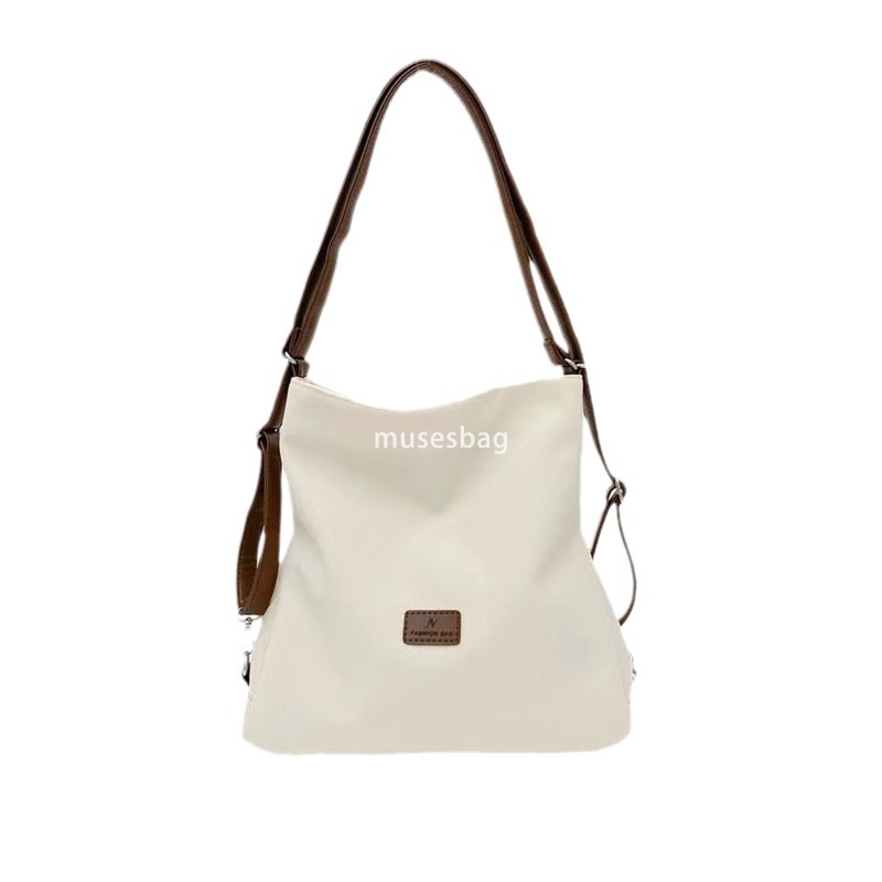 Street trend niche design spring and summer new canvas tote bag multifunctional single shoulder crossbody bag popular contrasting color women's b