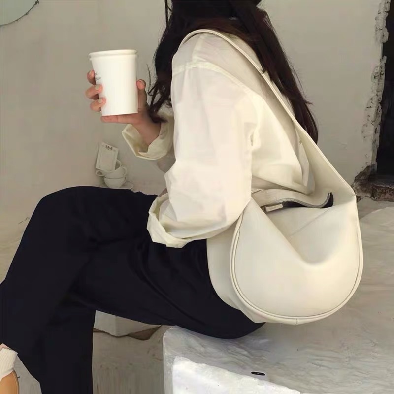 Korean version of women's bag for spring and summer new high-capacity Instagram soft leather handbag niche single shoulder bag wide shoulder dail