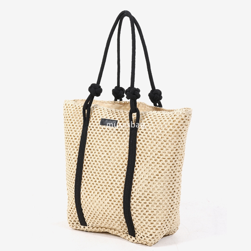 Fashionable women's high-end simple and large capacity single shoulder tote grass woven bag new practical hollow woven bag vacation beach bag ver