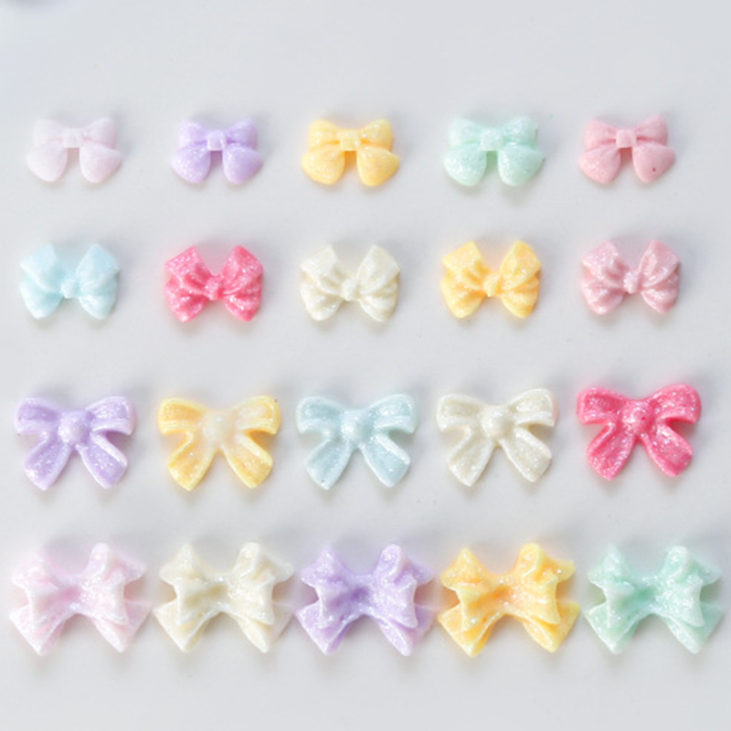 100Pcs/Bag Mini Bow 3D Cute Nail Art Decorations Bowknot Ornament Shiny Charm Jewelry DIY Resin Accessories Flat Back