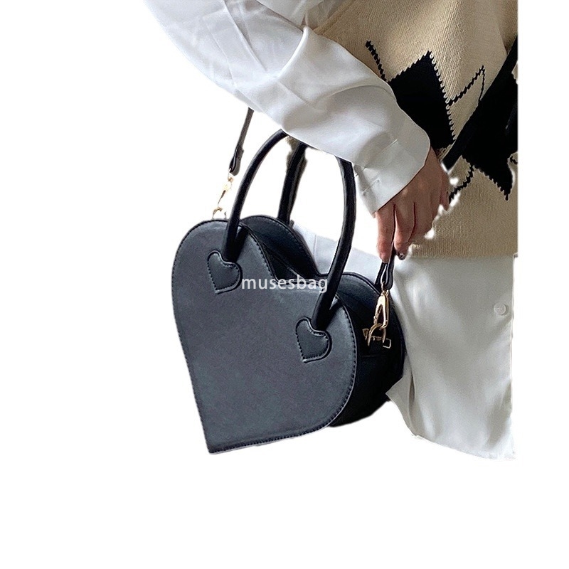 A niche design for street trendy girls a niche love bag a new fashionable and minimalist handbag for women a retro black one shoulder diagonal cross b