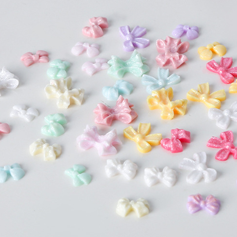 100Pcs/Bag Mini Bow 3D Cute Nail Art Decorations Bowknot Ornament Shiny Charm Jewelry DIY Resin Accessories Flat Back