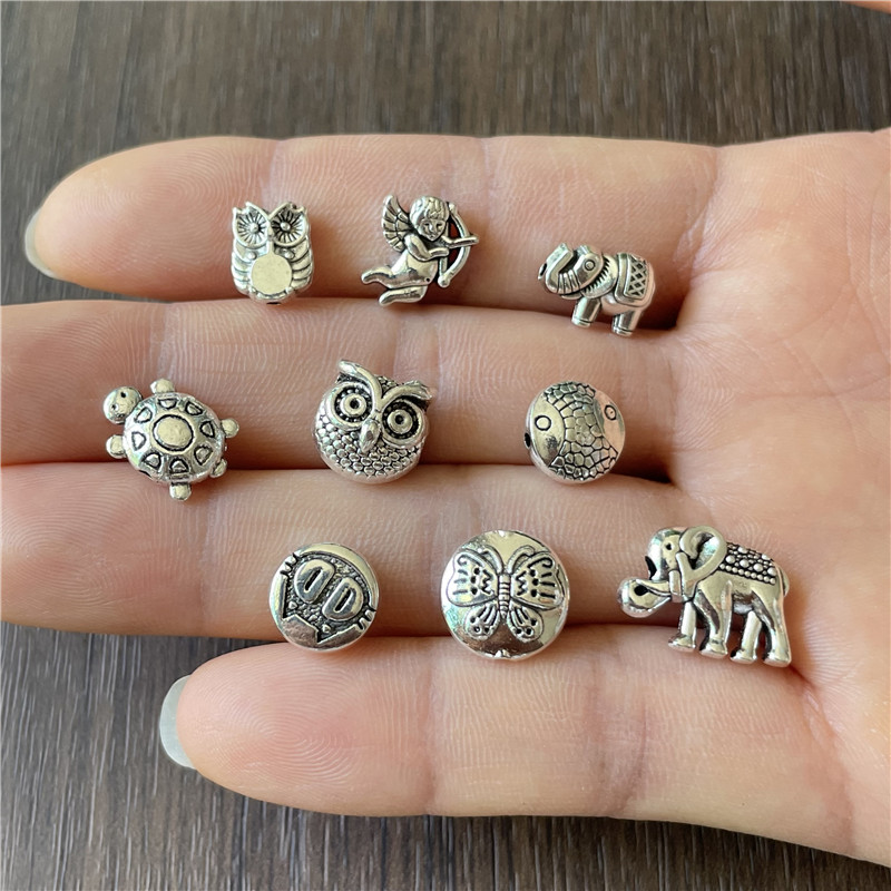 JunKang 90pcs 9 kinds animal series owl fish turtle baby elephant angel butterfly perforated beads DIY bracelet necklace gasket