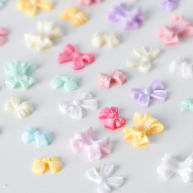 100Pcs/Bag Mini Bow 3D Cute Nail Art Decorations Bowknot Ornament Shiny Charm Jewelry DIY Resin Accessories Flat Back
