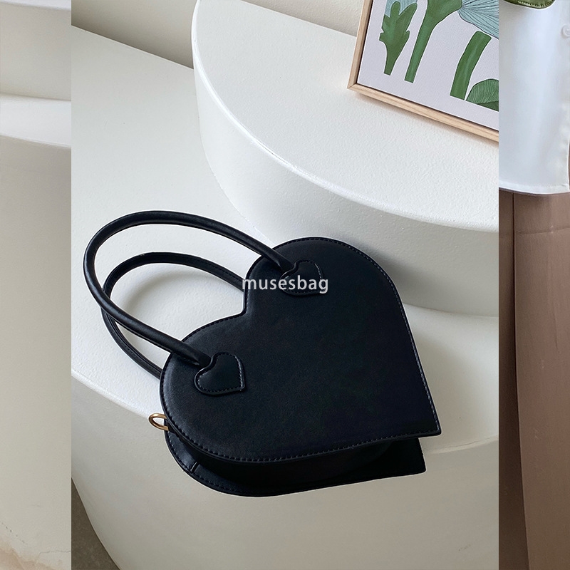 A niche design for street trendy girls a niche love bag a new fashionable and minimalist handbag for women a retro black one shoulder diagonal cross b