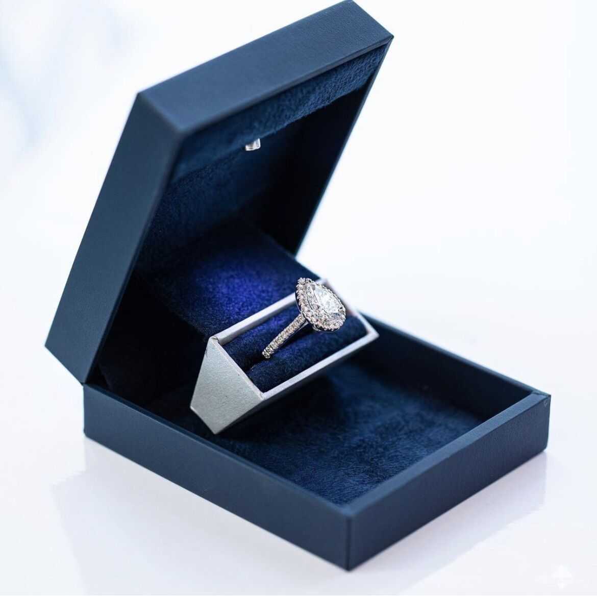 Platinum 3.46ctw Pear and Round Brilliant Cut Moissanite Diamond Ring