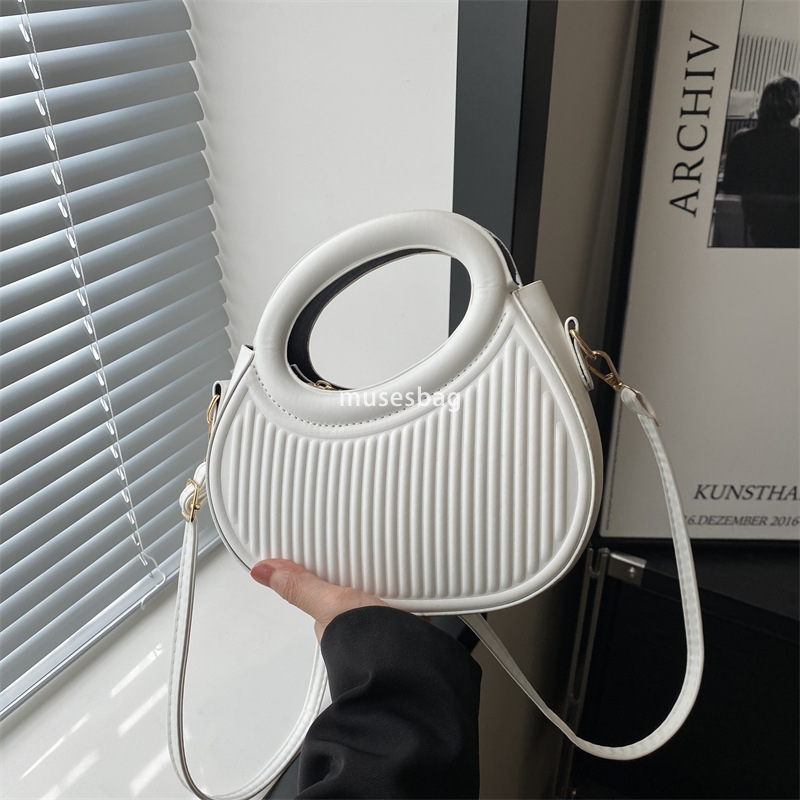Street trend soft leather pleats personalized trend minimalist ins crossbody bag new spring portable shoulder commuting bag for women
